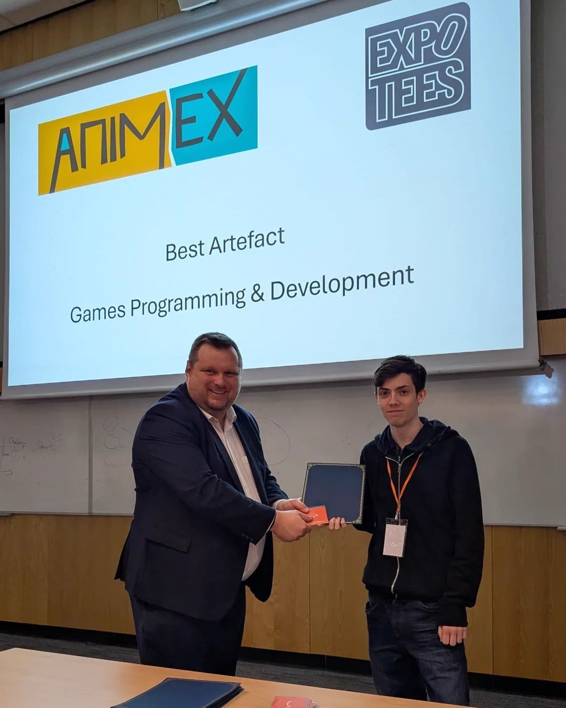 Oliver Neal receiving the Best Artefact award for Games Programming and Development at ExpoTees 2026